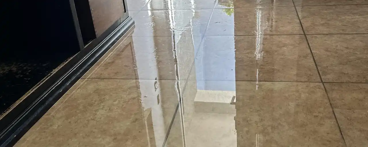 Standing water on a tile floor in a Mesa home — Fast Track Restoration job photo