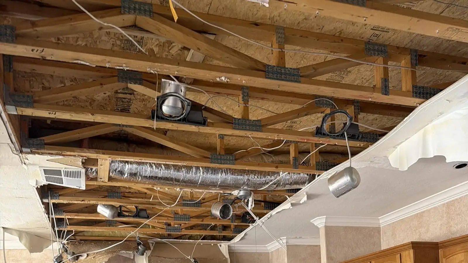 Kitchen ceiling opened up after a roof leak — Fast Track Restoration job photo