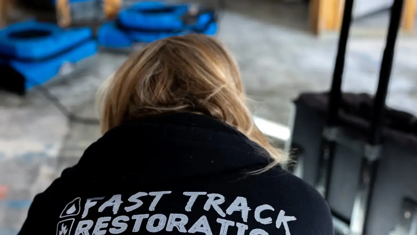 Fast Track Restoration technician on a jobsite with drying equipment