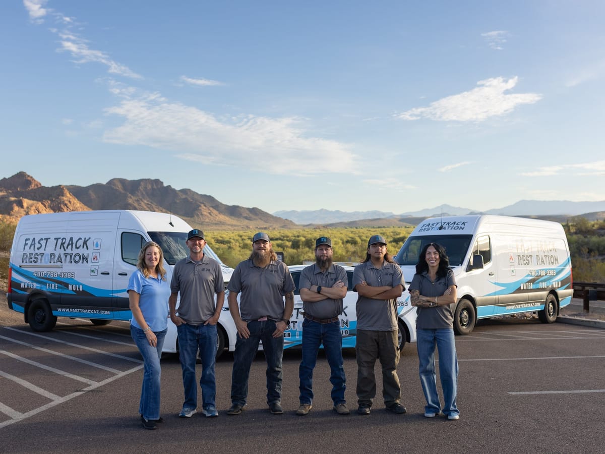 The Fast Track Restoration team with the company vans