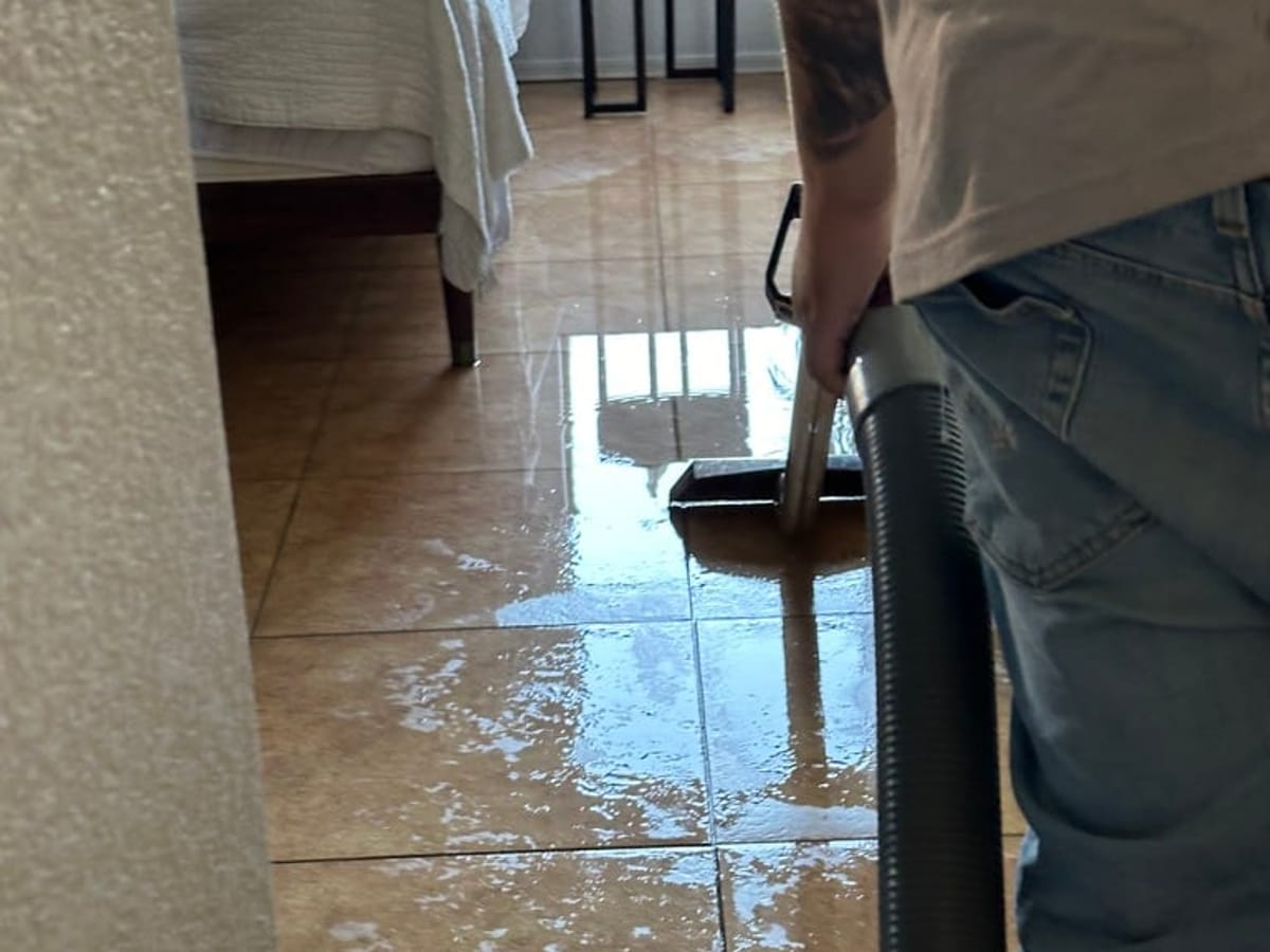 Extracting standing water with a wand extractor